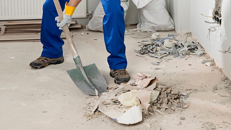 Crew clearing construction debris after a build